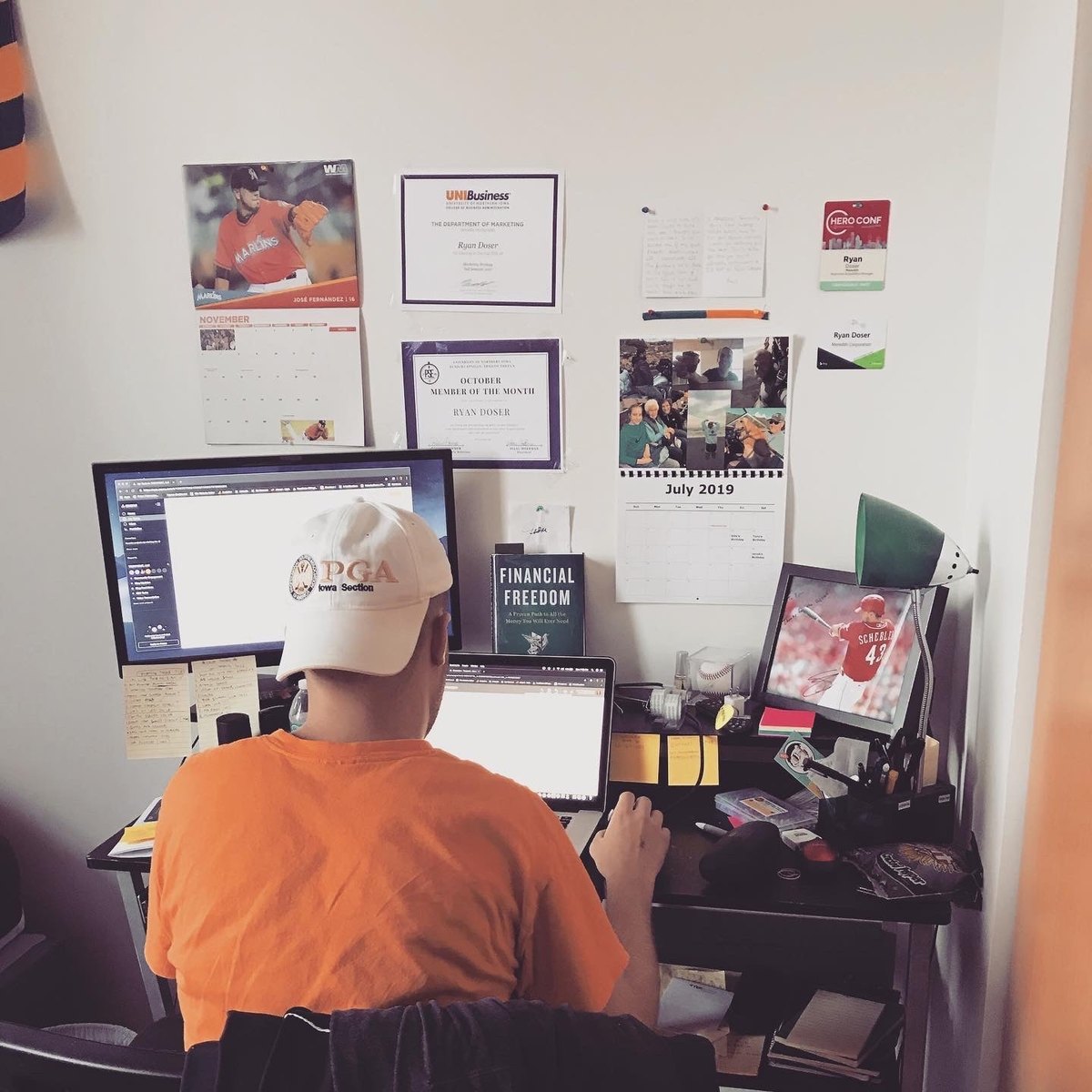 Ryan Doser working at a small desk in July 2019, the first month of running his own business